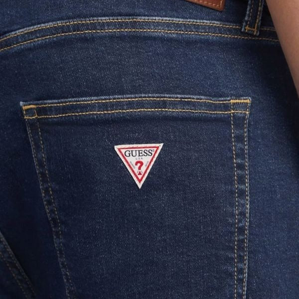GUESS Slim jeans uomo cinque tasche aderente sui fianchi chiusura con zip e bottone