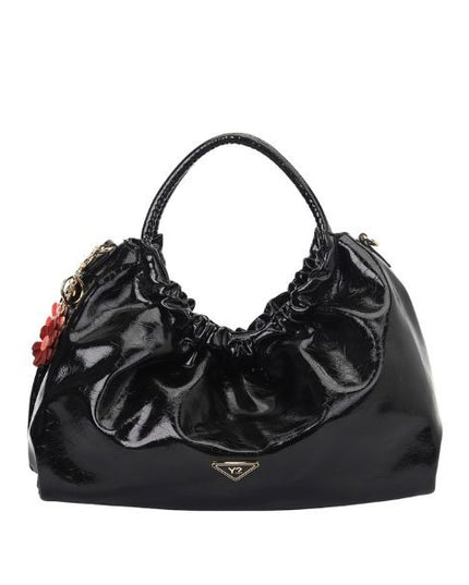 YNOT? Borsa a mano nera lucida con pendenti floreali e doppio manico